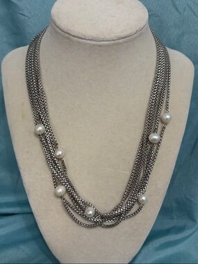 Silver and Pearl 6 strand necklace with a Crystal Latch